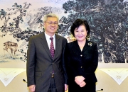 廖岷会见美国前财政部长保尔森